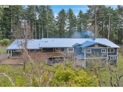 Home at 9790 NE Benton St, Newport, OR 97365