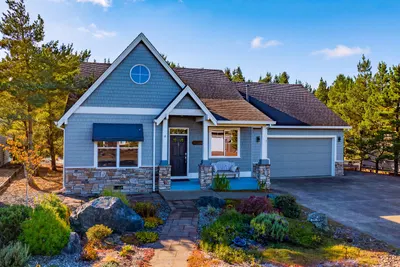 Forest at the back door. Community green space beside you. And a Manzanita home designed for actually living at the coast. 🌲