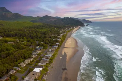 aerial view at sunset looking down a row of beach homes