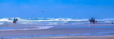 Horse back riding on the beach of Cape Meares Oregon
